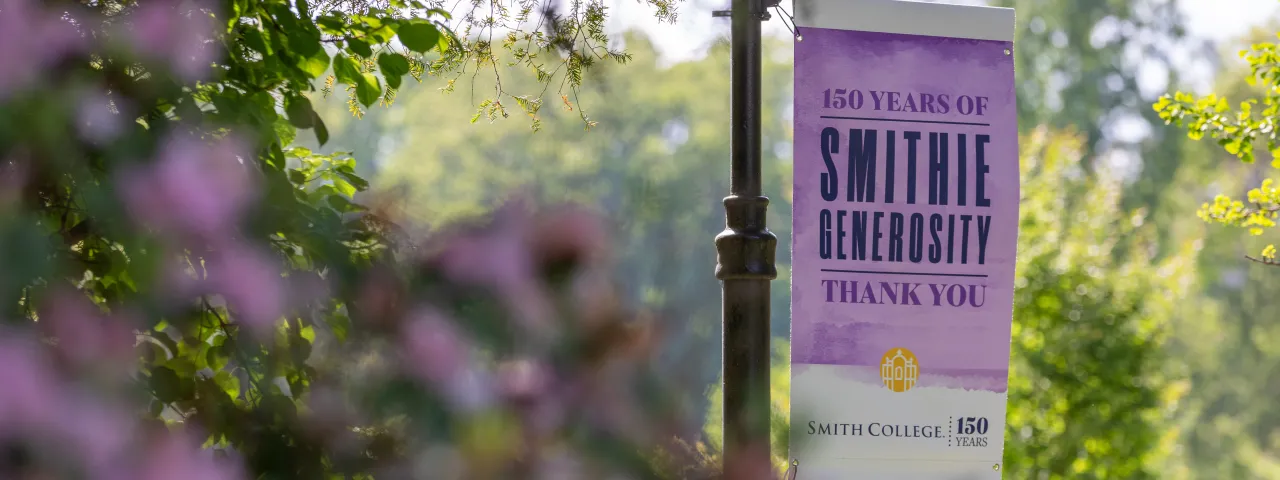A banner on campus saying "150 years of Smithie generosity"