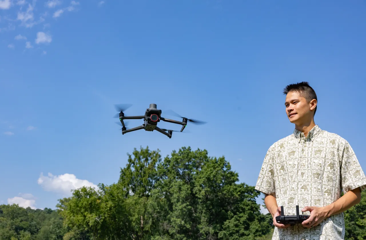 Kala'i Ellis brings Patty the drone in for a landing near Paradise Pond