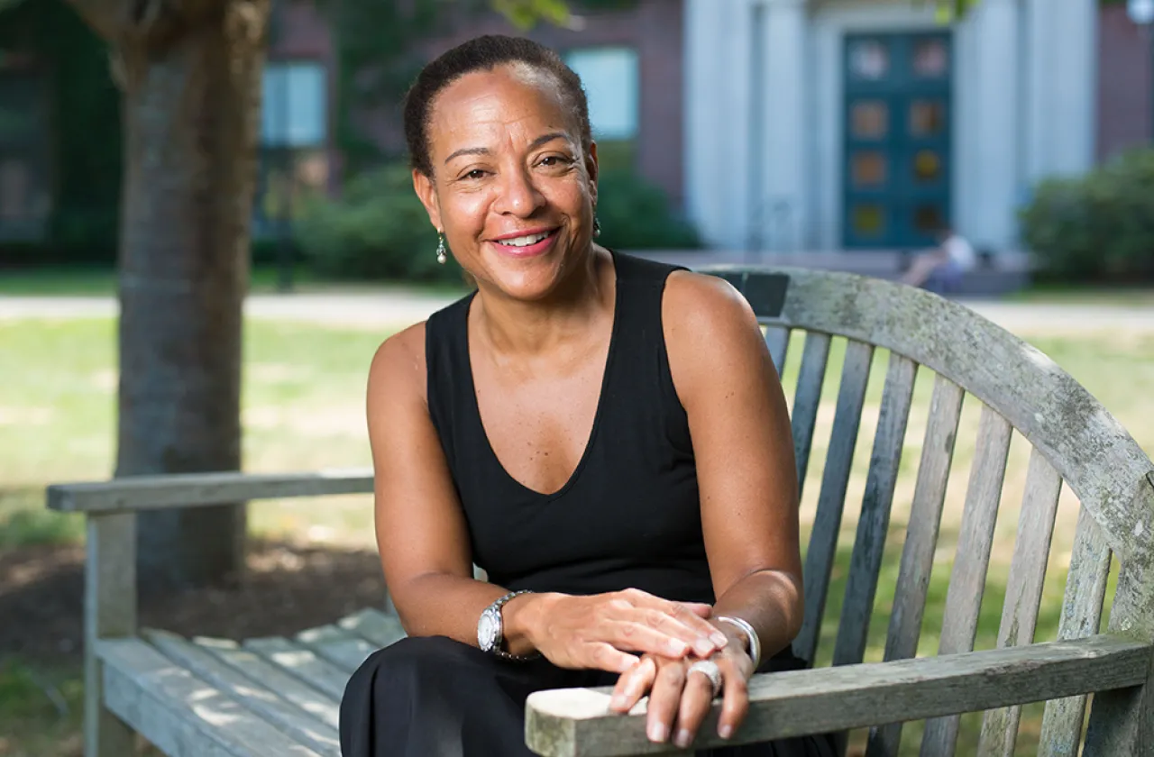Monica Dean on a bench outside Bass Hall