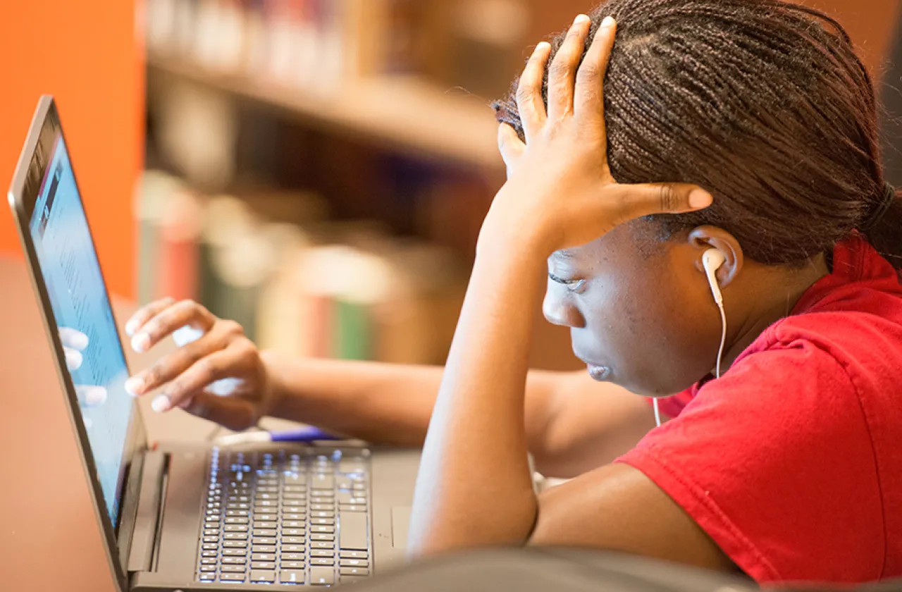 Student studying in Neilson Library