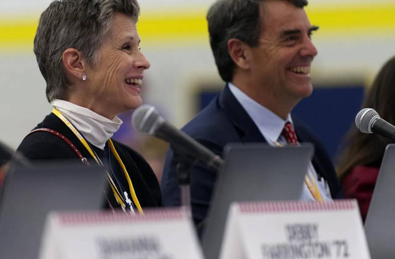 Tim Draper and Melissa Park Draper ’77 listen to student presentations 