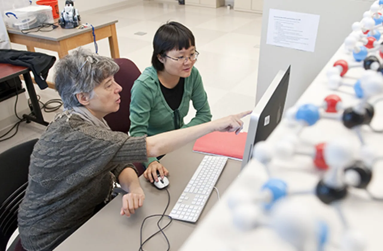 Professor Ileana Streinu with student in class