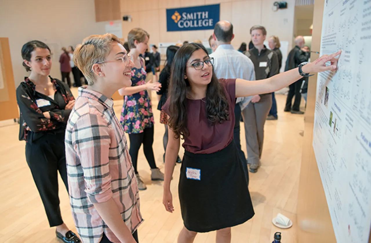 Students presenting research poster at Celebrating Collaborations