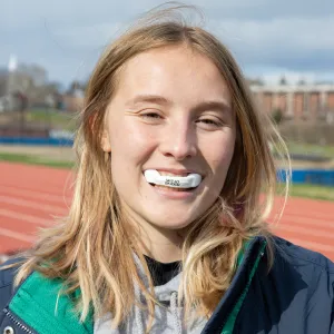 Sensors attached to mouthguards track the rate and velocity of hits to the head.