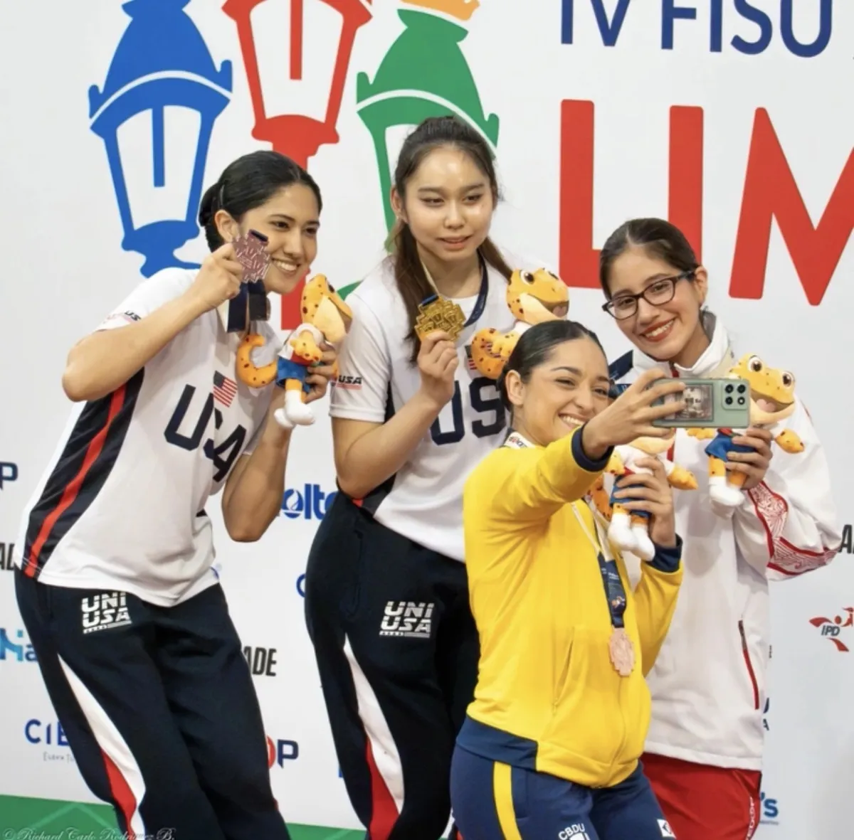 Aahana Mulchandani '28 at far left poses with members of the U.S. poomsae team at a taekwondo competition in Peru