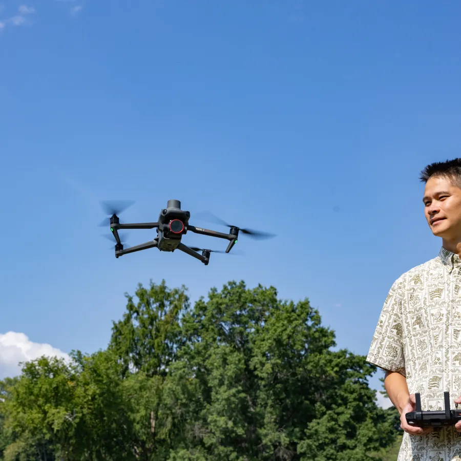 Kala'i Ellis brings Patty the drone in for a landing near Paradise Pond