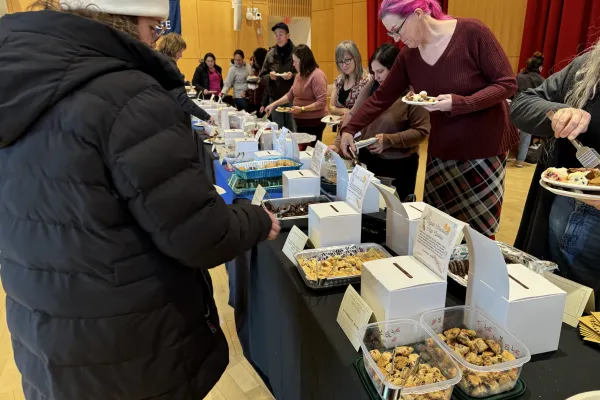 Staff members sample cookies