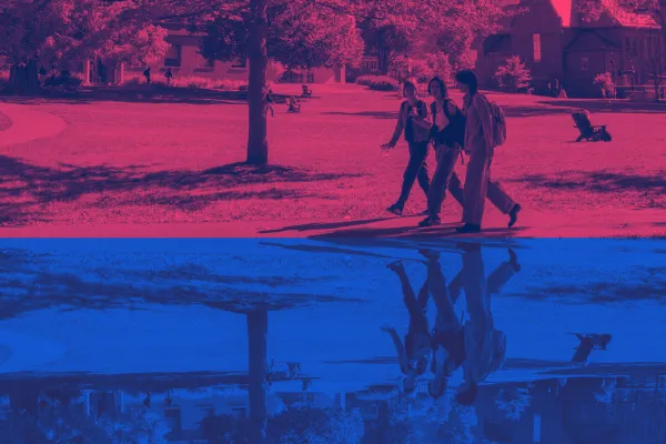 Three students walking on Smith's campus; the top of the photo is right side up, the bottom half of the photo is upside down.