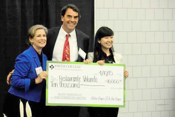 Melissa Draper '77 and her husband, Tim, giving first place award to Wellesley student Mojia Shen at last year's Draper Competition at Smith. Smithies hope to take the top prize this year.
