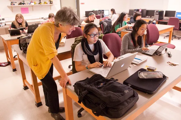 Ileana Streinu and a student working in a computer lab