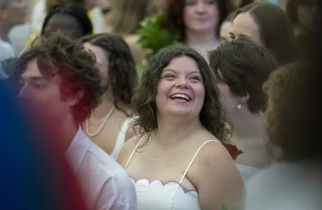 A senior smiles in the crowd on Ivy Day