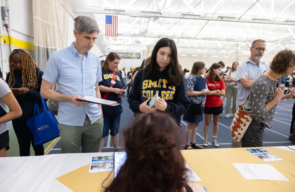 A student and their parent at central check-in