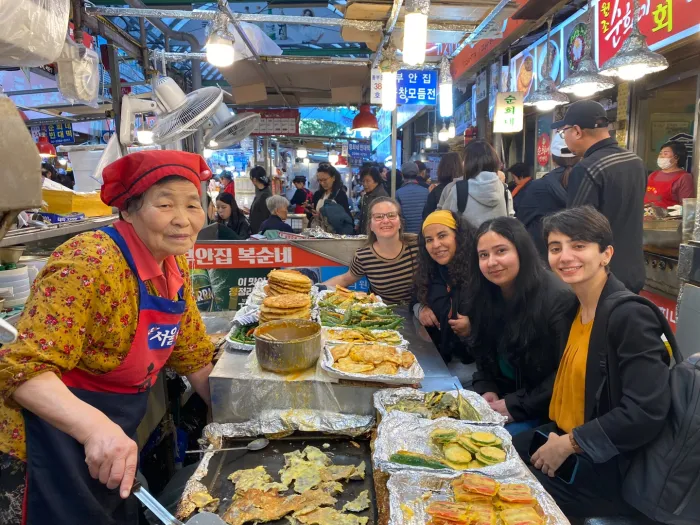 Smith alums at a marketplace in Seoul.