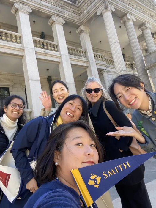 Smith alums in front of the palace.