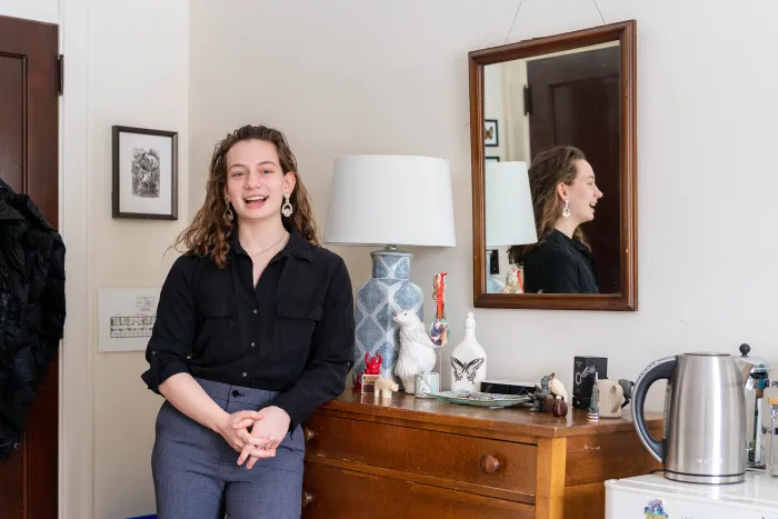 Sophia Romagnoli in front of her dresser in Emerson House