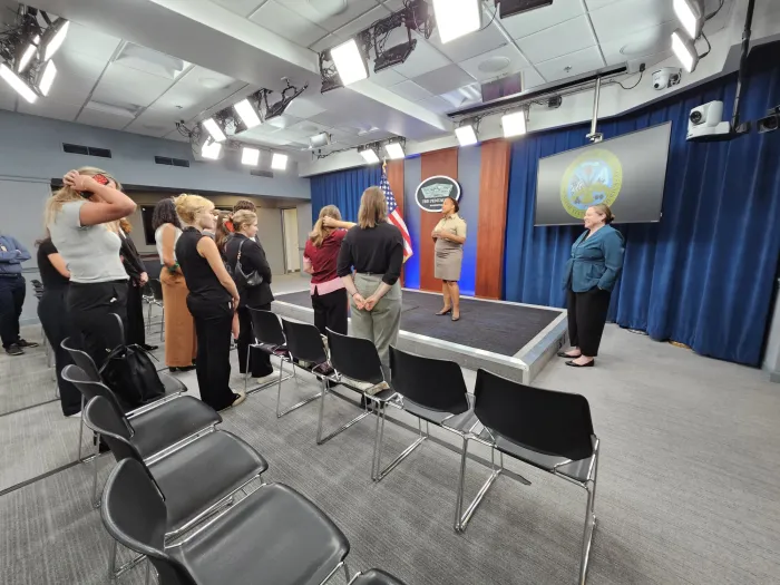 Smith students listen to public affairs officials in the Pentagon Press Briefing Room during a visit to the Pentagon hosted by Honorable Laura Taylor-Kale '00, assistant secretary of defense for industrial base policy.