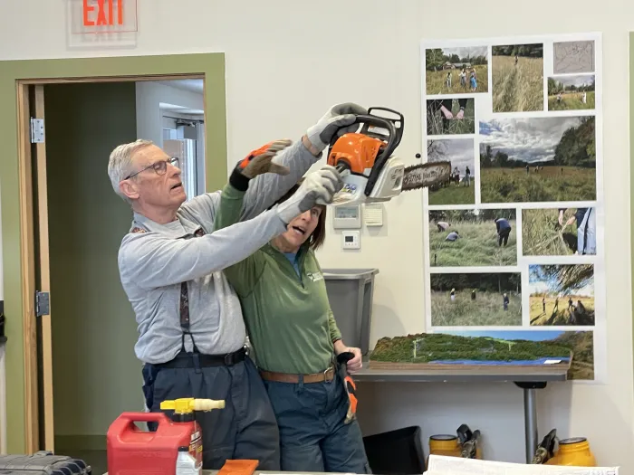 Craig Houghton and Beth Brantley review how to operate a chain saw.