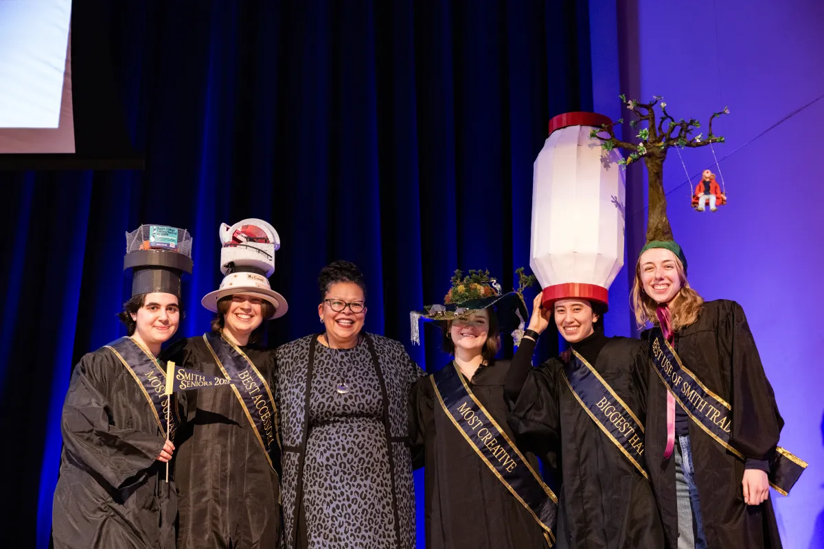 President Sarah with winners of the 2025 Rally Day hat competition on stage in John M. Greene Hall.