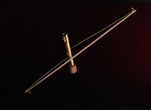 A metallic body with taut, elegant string