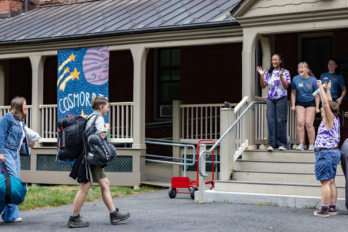Housemates greet a new student at 