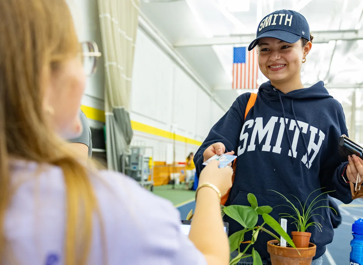 A new student receives their OneCard at Central Check-In.