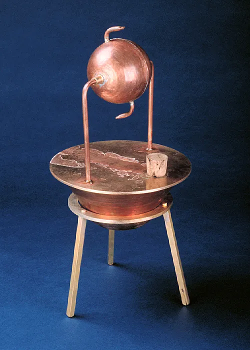 An antique, copper steam engine model features a spherical chamber, curved tubes, and stands on three legs