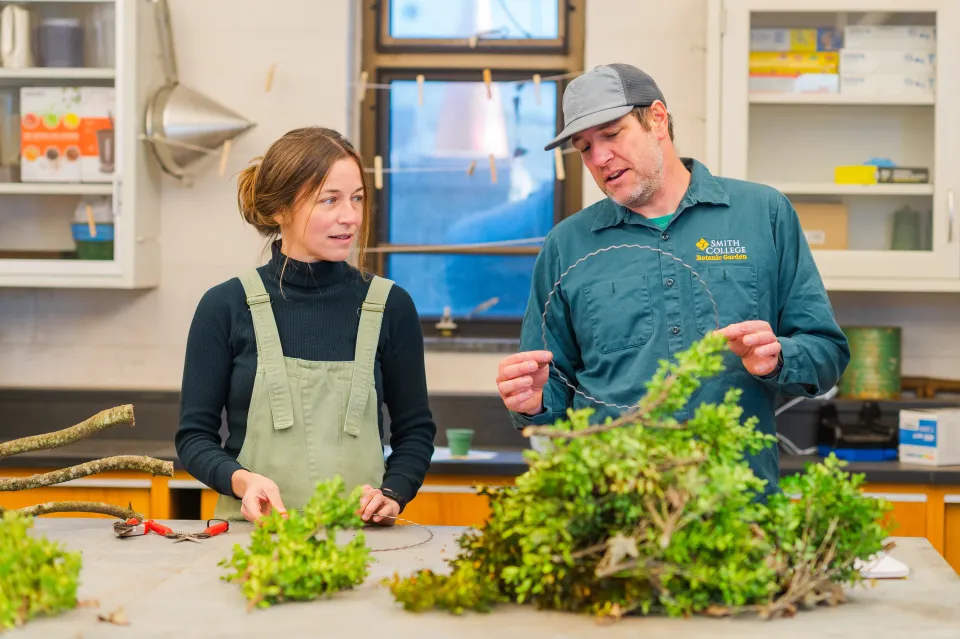Julie Thomson and Dave Dion examine a metal wreath ring