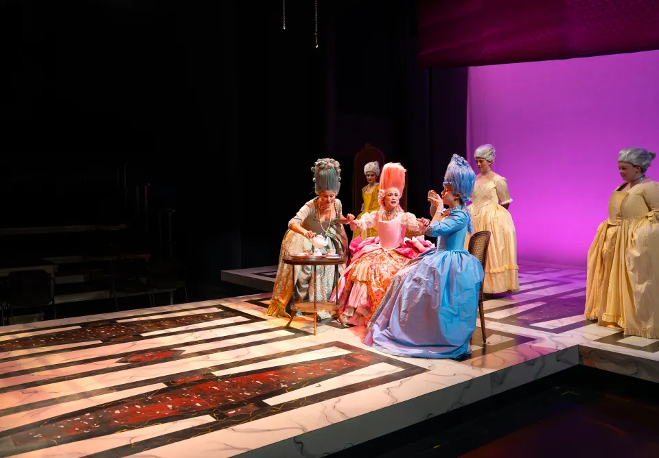 Student actors on stage during Marie Antoinette