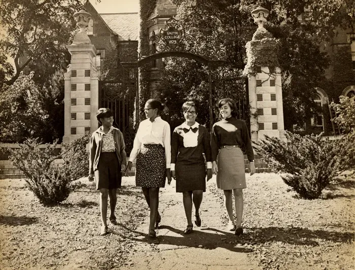 A group of Smithies walking away from the Grécourt Gates, smiling