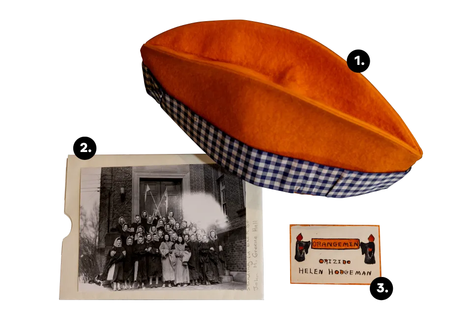 An orange felt hat, a black and white photograph, and an old nametag