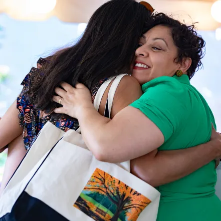 Two alums hugging at Reunion